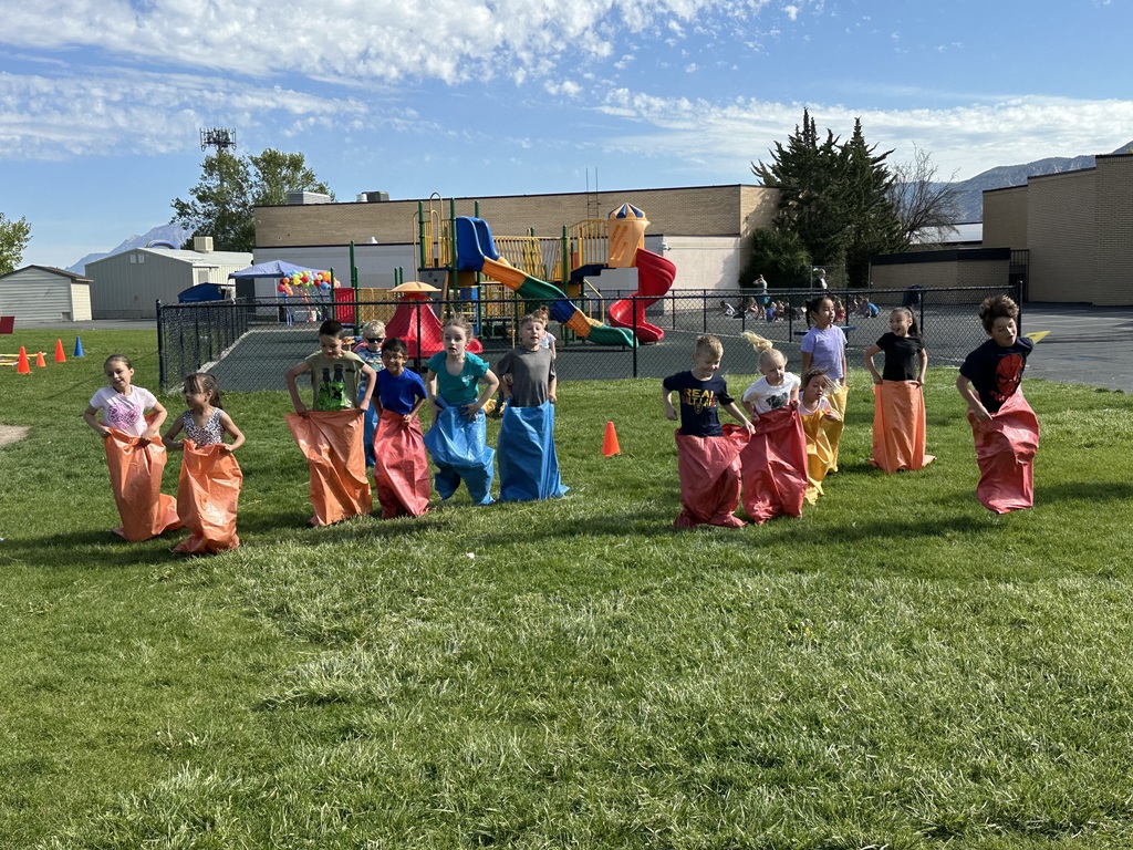 students in a sack race