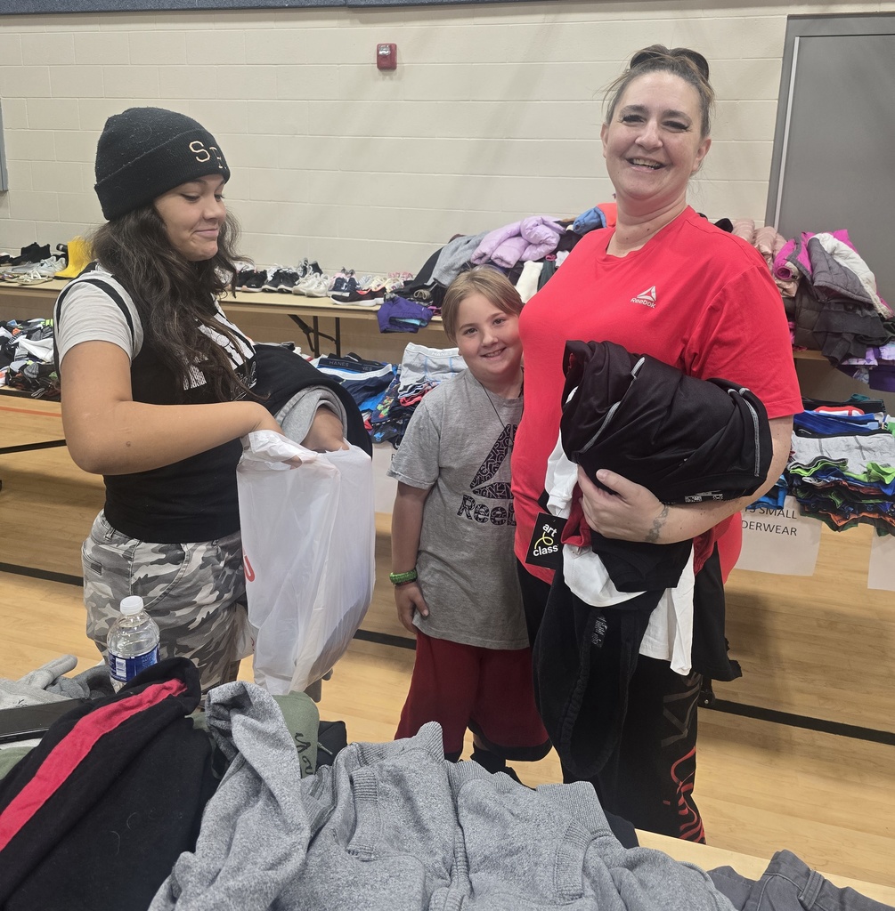 Family at clothing event, mother, daughter and son