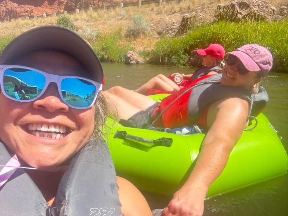 Mrs. Bingham tubing down the river