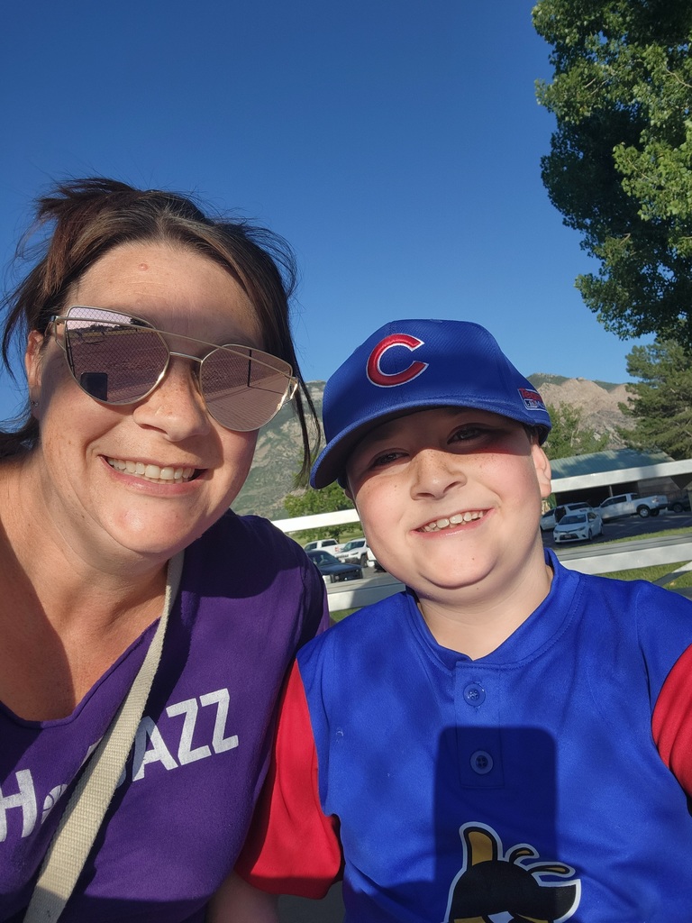 Mrs. Smith and son at a baseball game