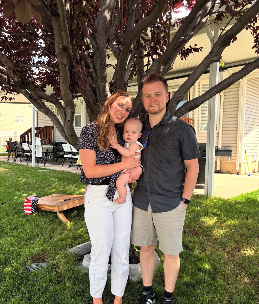 Mrs. Roberts with her husband and baby