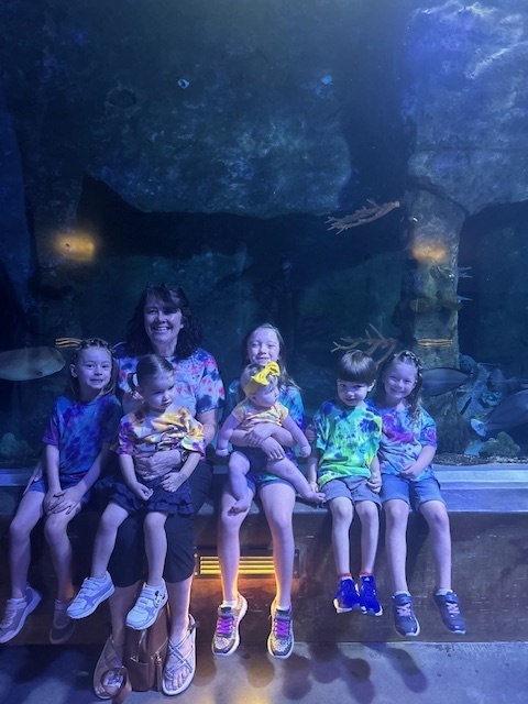 Mrs. Stalder with her grandkids at aquarium
