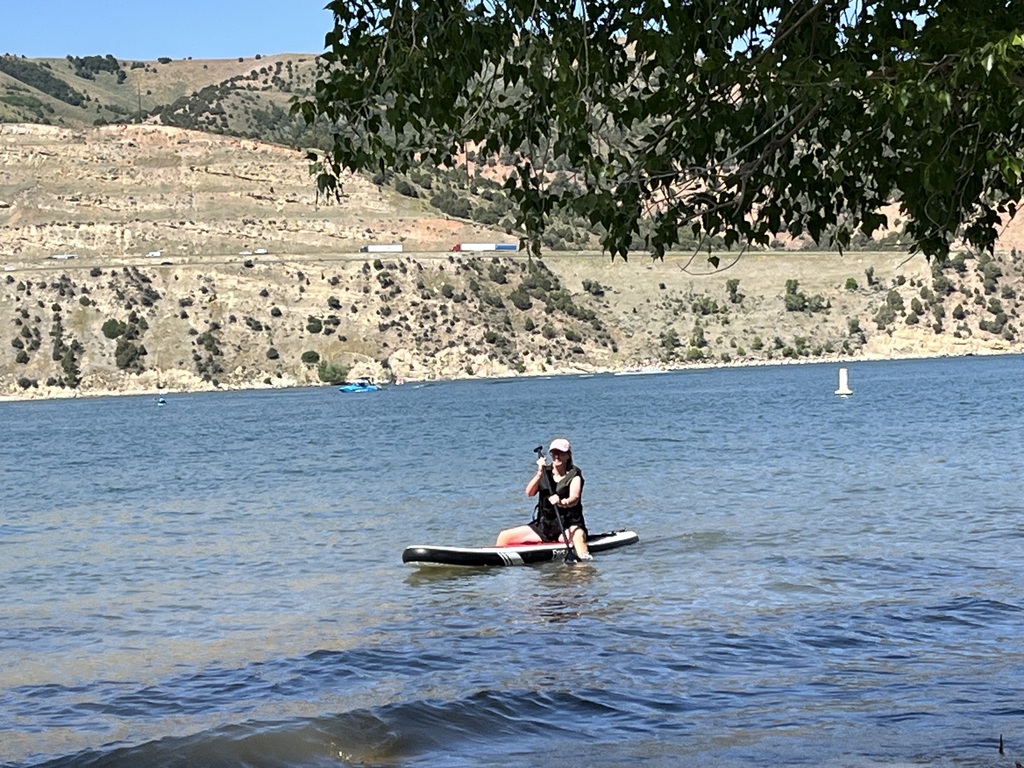 Mrs. Perry paddleboarding