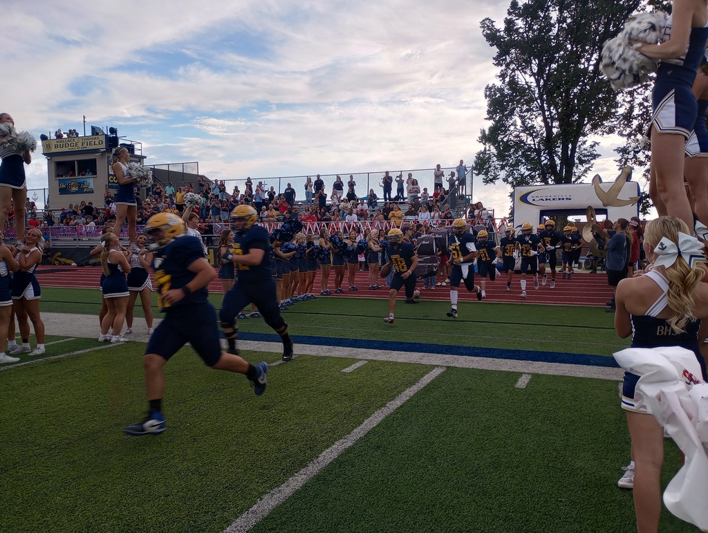 Football team running onto the field
