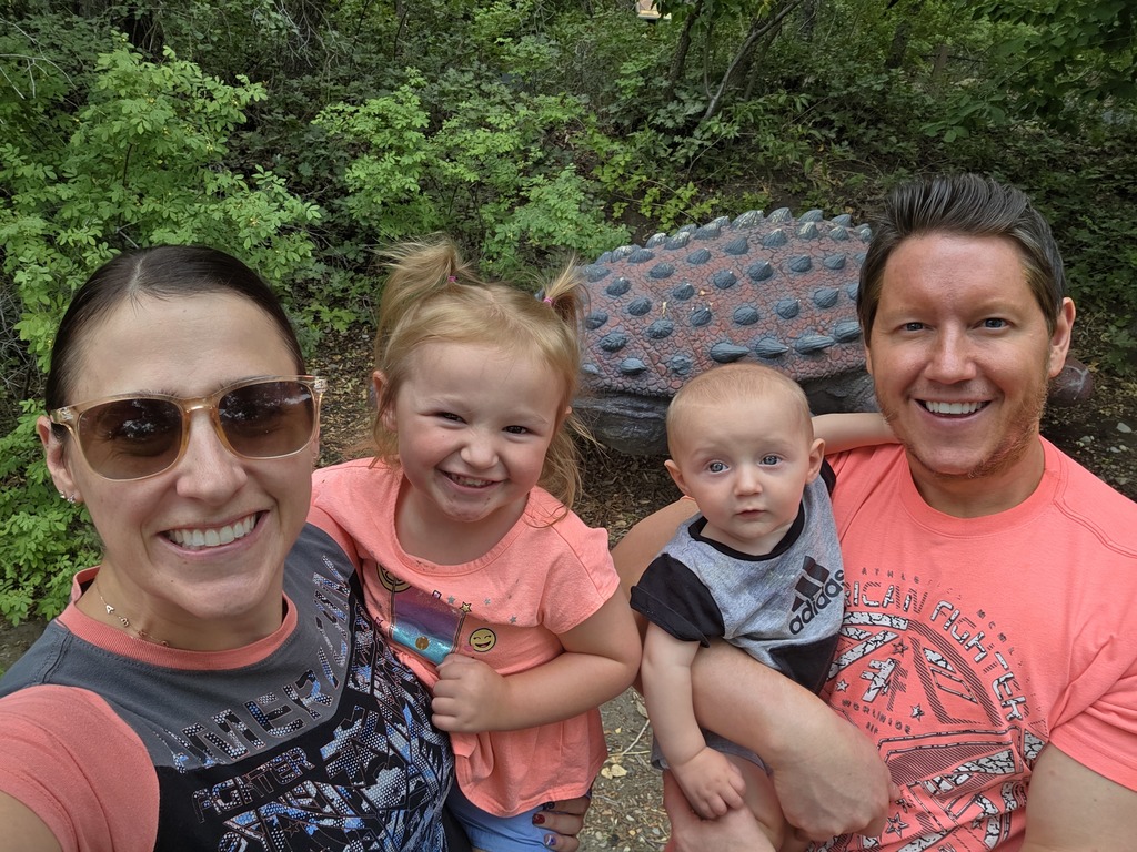 Mrs. and Mr. Warren at the dinosaur park with their kids