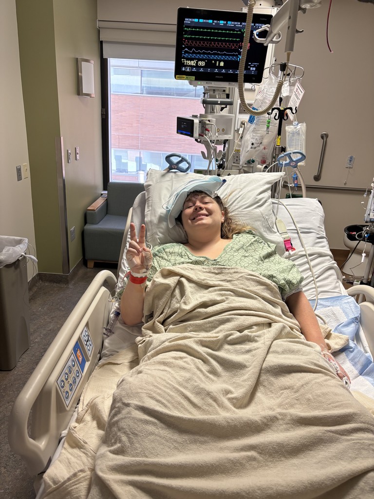 Mrs. Dalrymple in a hospital bed