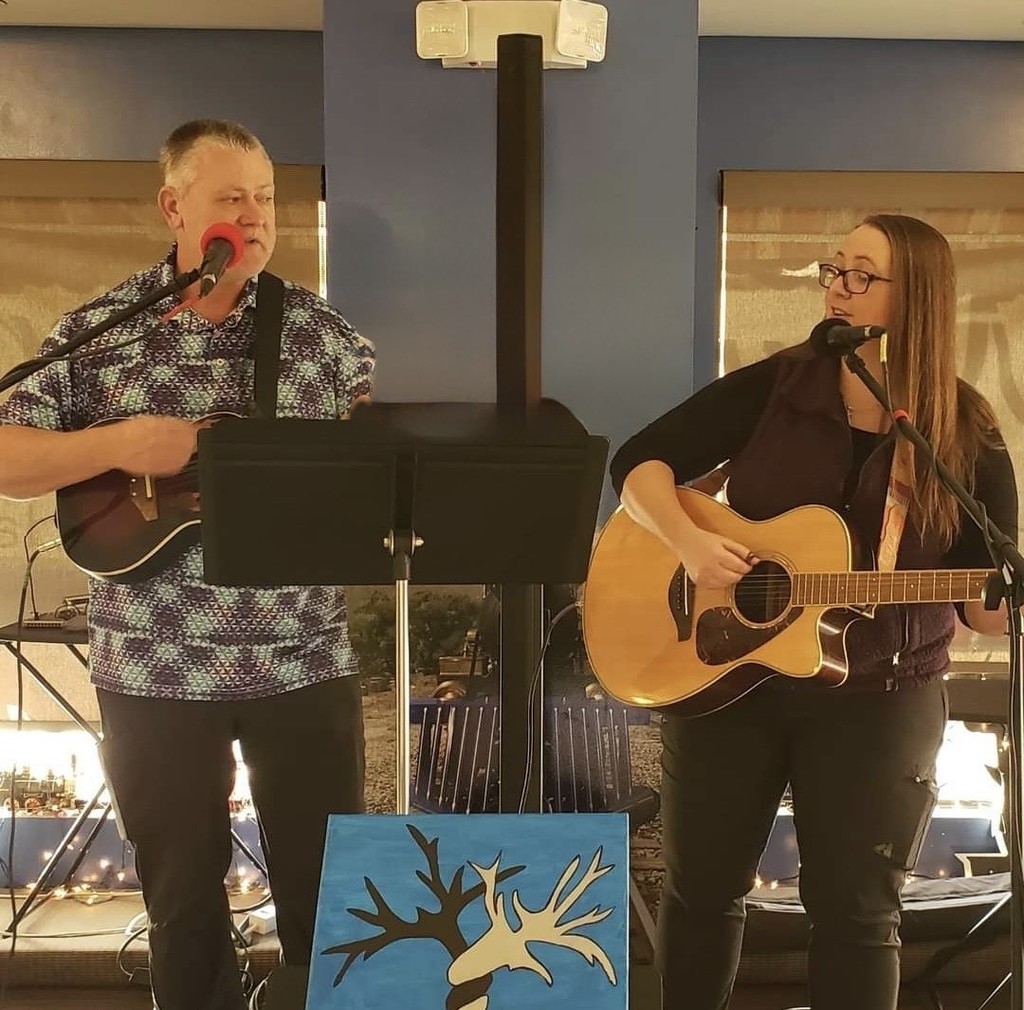 Mrs. Bennet Singing with guitar
