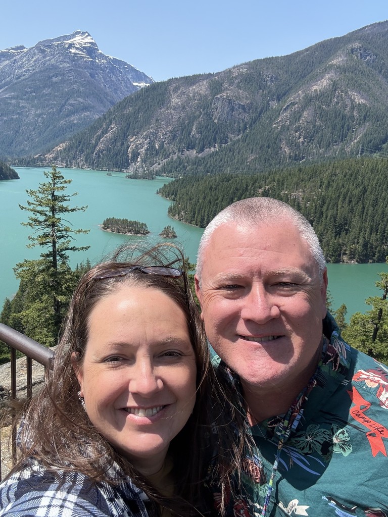 Mrs. Bennett and husband at a lake