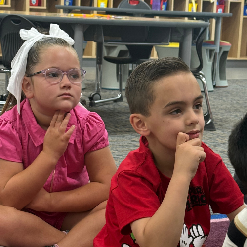 Children listening to a school discussion