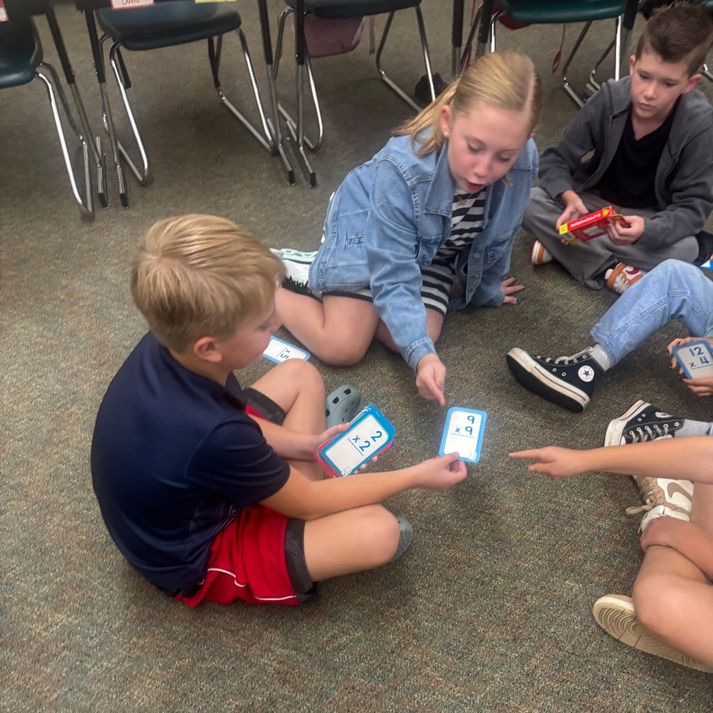 students playing math games in a classroom