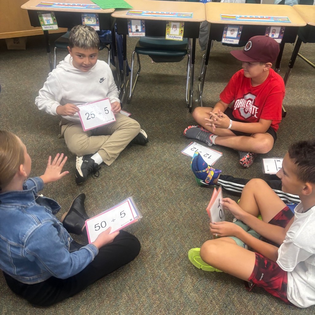 students playing math games in a classroom