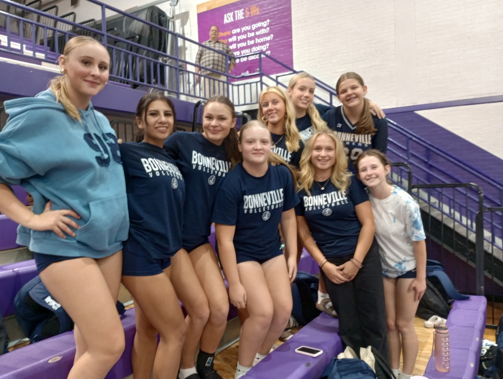 volleyball team cheering on the bleachers
