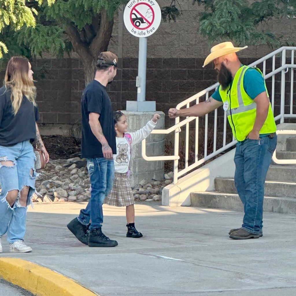 Rad dad giving a student a high five.