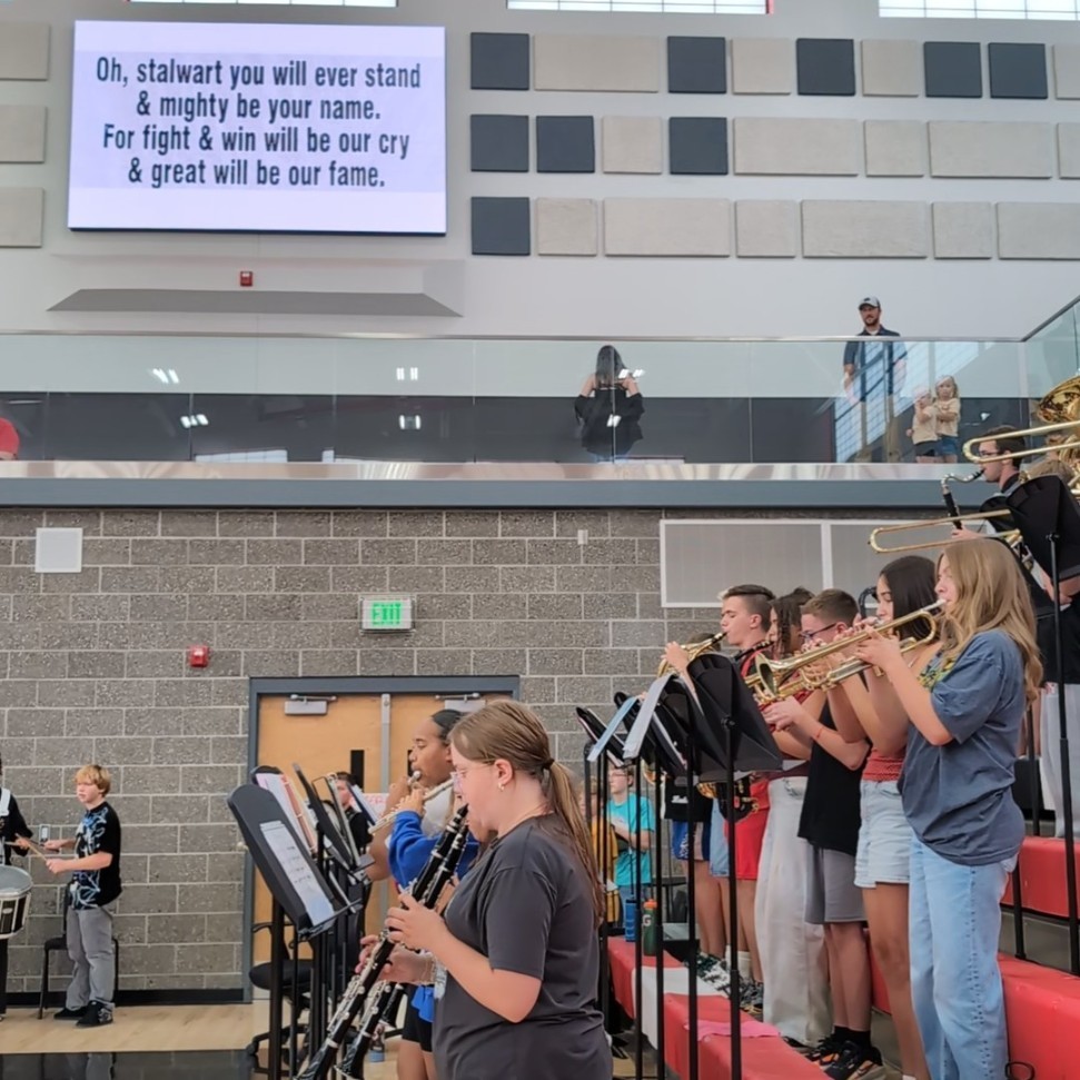 photo of opening assembly at Roy jr high, band playing Roy Jr school song