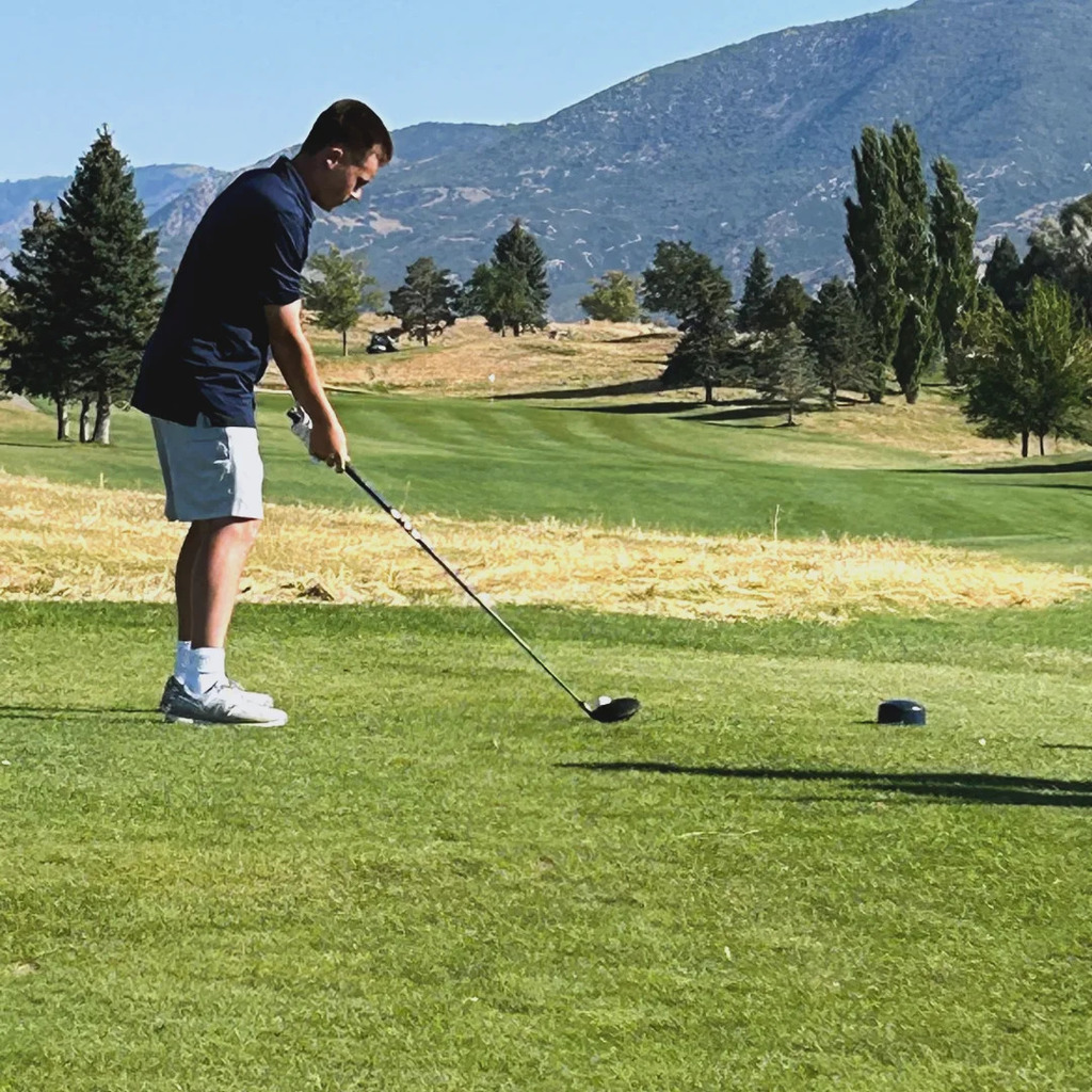 golfer up to the tee box