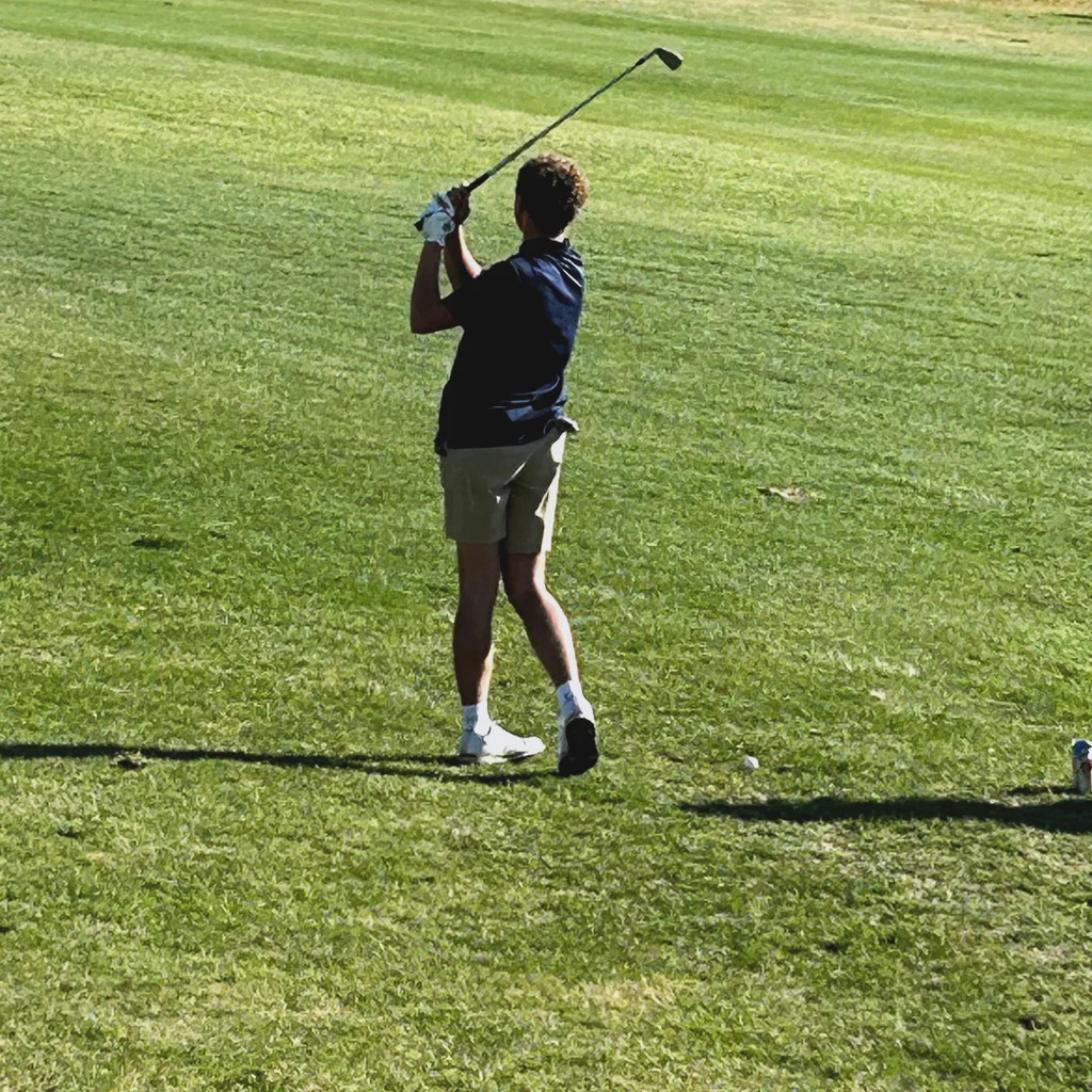 golfer just completing his swing