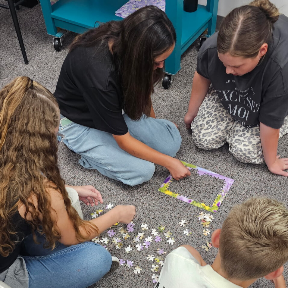 Beginning of the year community building games. Students had to work together to put together a puzzle without the picture.