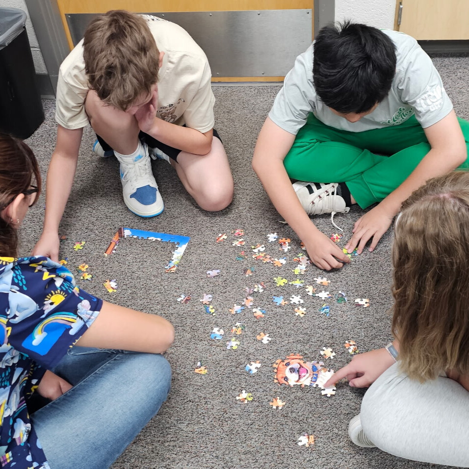Beginning of the year community building games. Students had to work together to put together a puzzle without the picture.