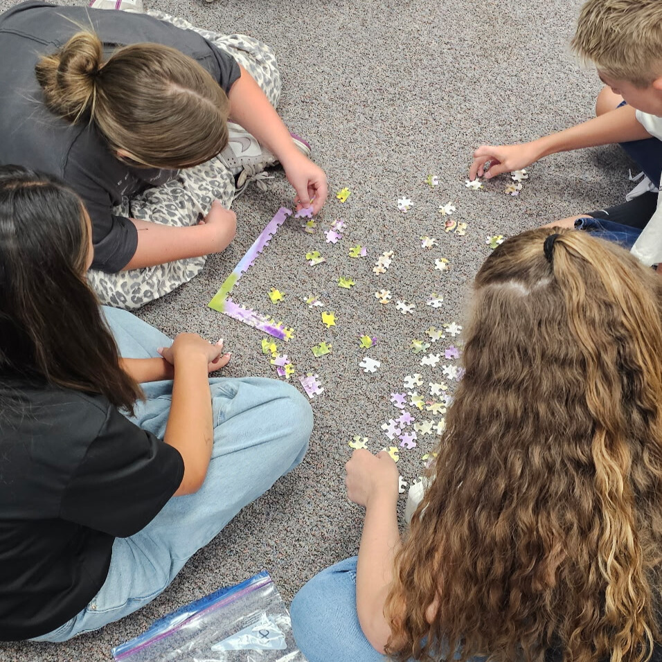 Beginning of the year community building games. Students had to work together to put together a puzzle without the picture.