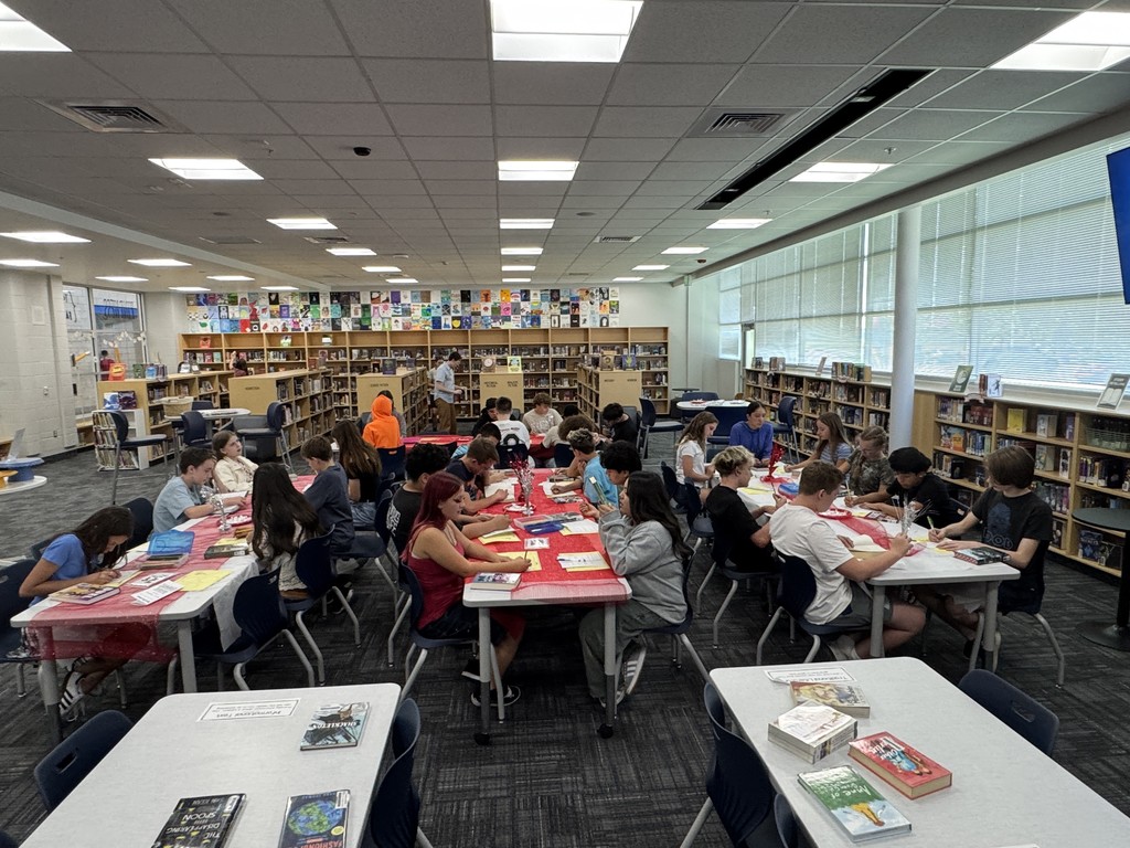 Students looking at books.