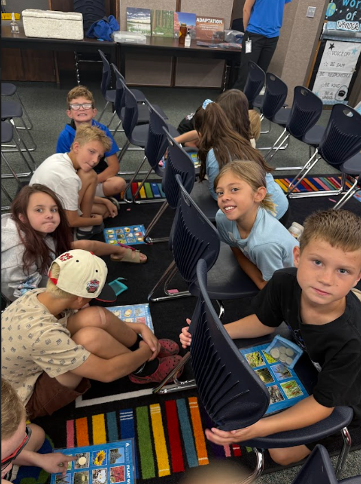 Students learning from books about animals