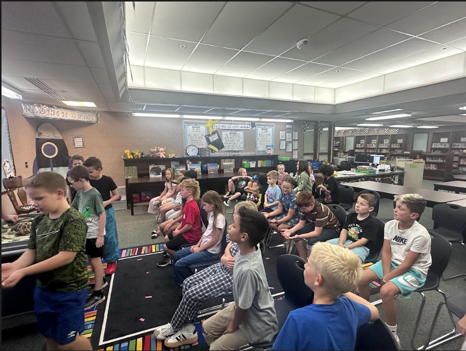 Students waiting to touch tortoise