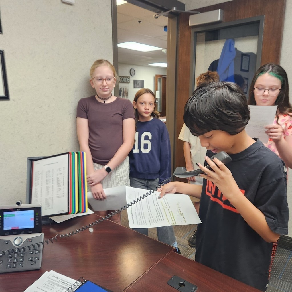 students doing morning announcements