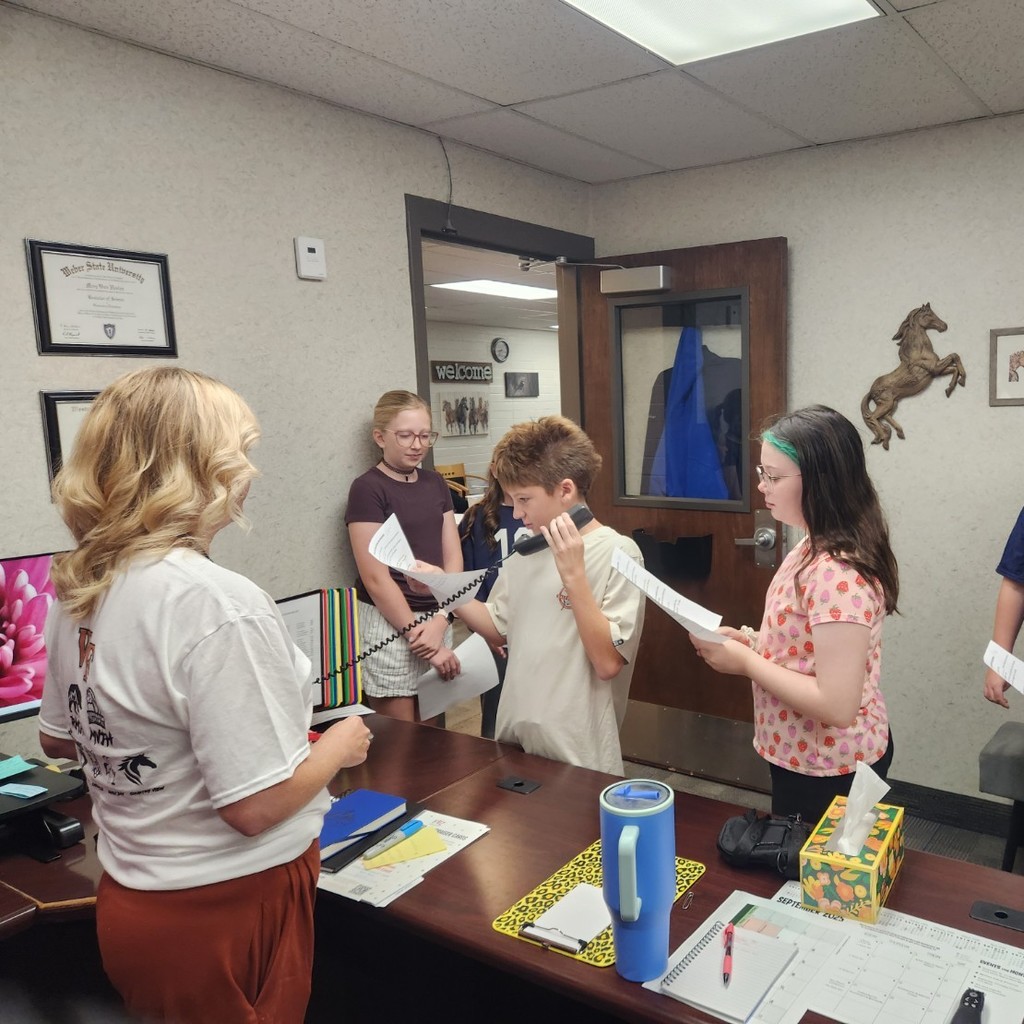 students doing morning announcements