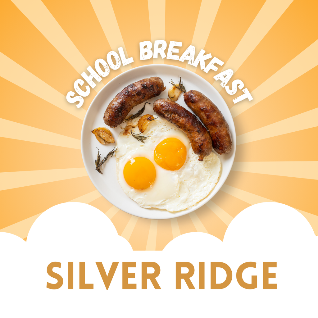 A promotional image for a school breakfast at Silver Ridge. The image features a plate with two sunny-side-up eggs, three sausages, garlic cloves, and herbs. The background has a bright orange and yellow sunburst design, with white cloud shapes at the bottom. The text reads "School Breakfast" above the plate and "Silver Ridge" below.