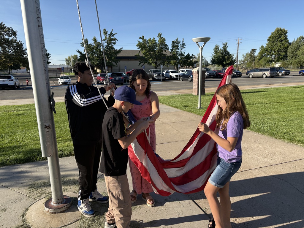 Students getting ready to hoist the American Flag