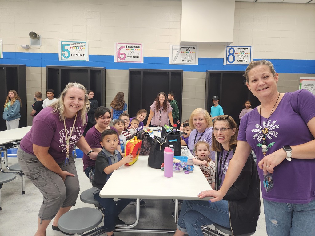 6th grade team wearing purple to support kindergarten