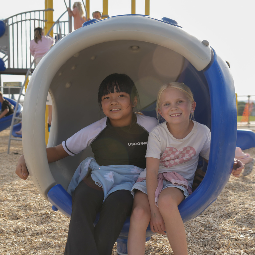 Students playing on new playground.