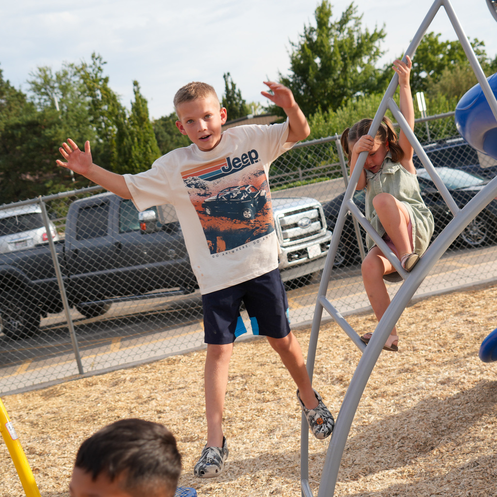Students playing on new playground.