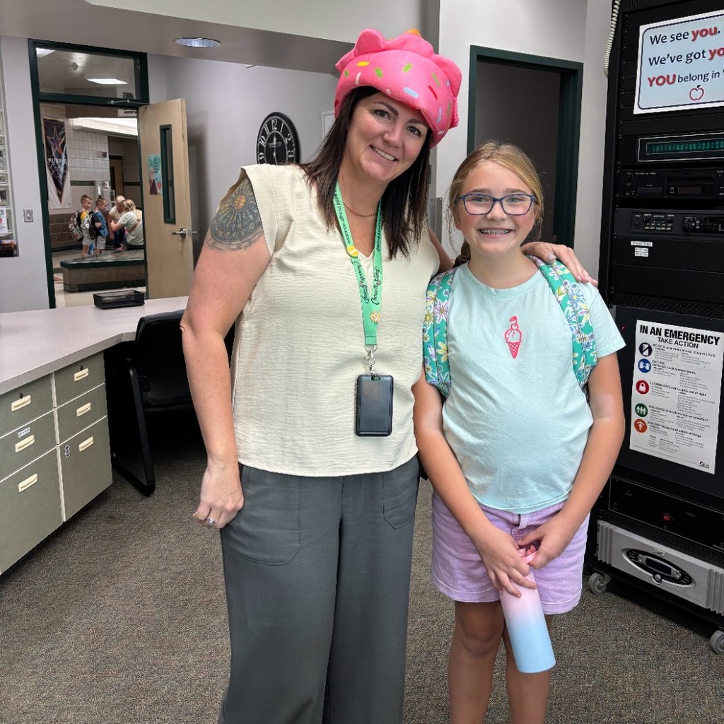 Mrs. Jacobsen in her icecream hat and a student in her icecream shirt.
