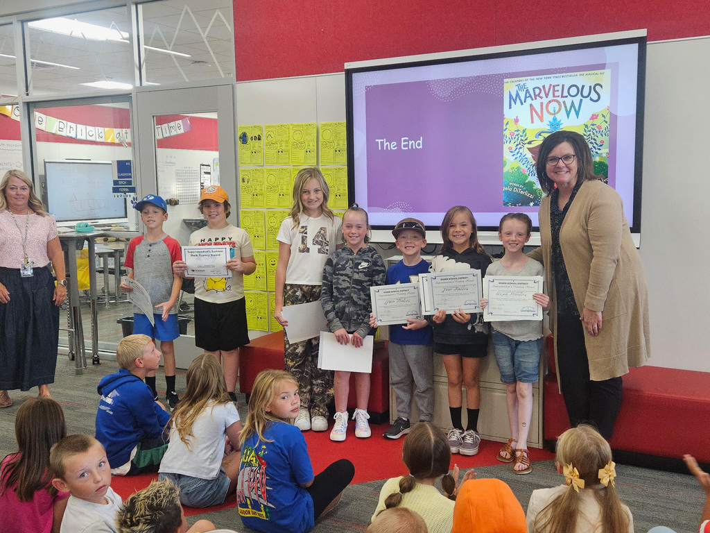 Students holding awards