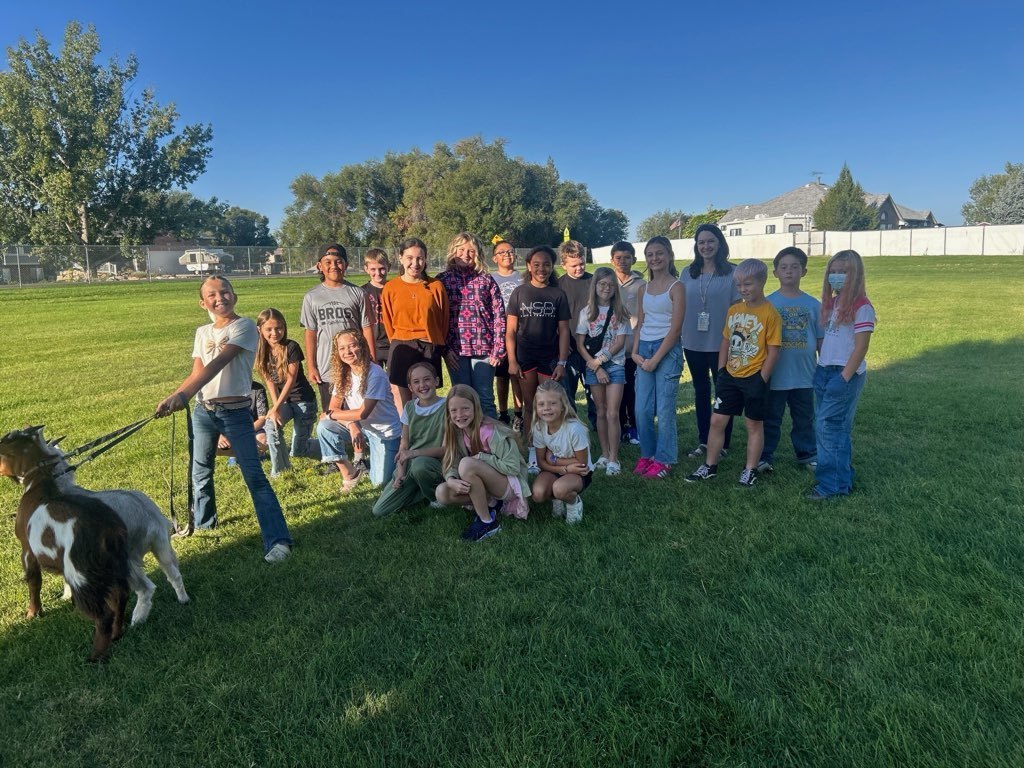 Students with goats