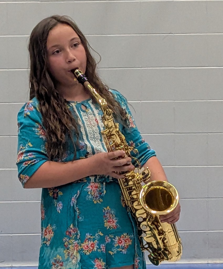Girl playing a saxaphone