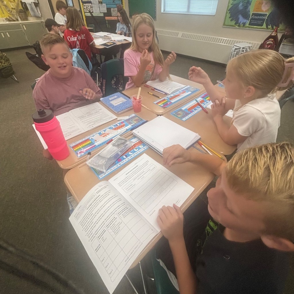 group of students working together to investigate properties of mixtures