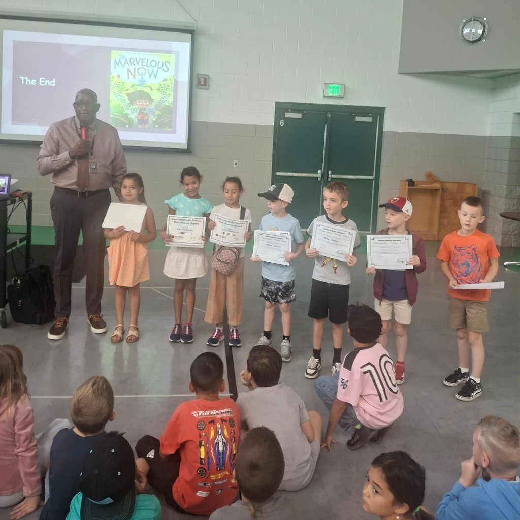 Students with their Summer Reading Awards and Superintendent Clyde Moore