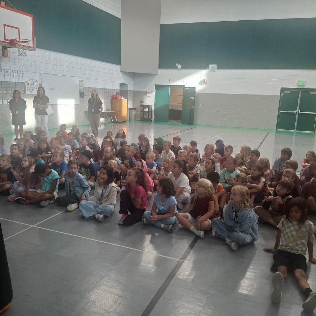 2nd grade students listening to a book.