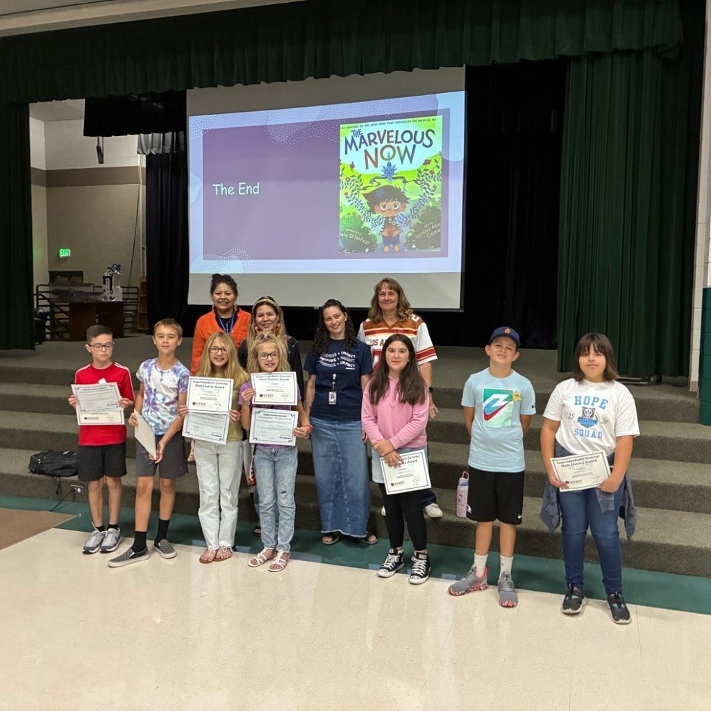 5th grade students with award certificates