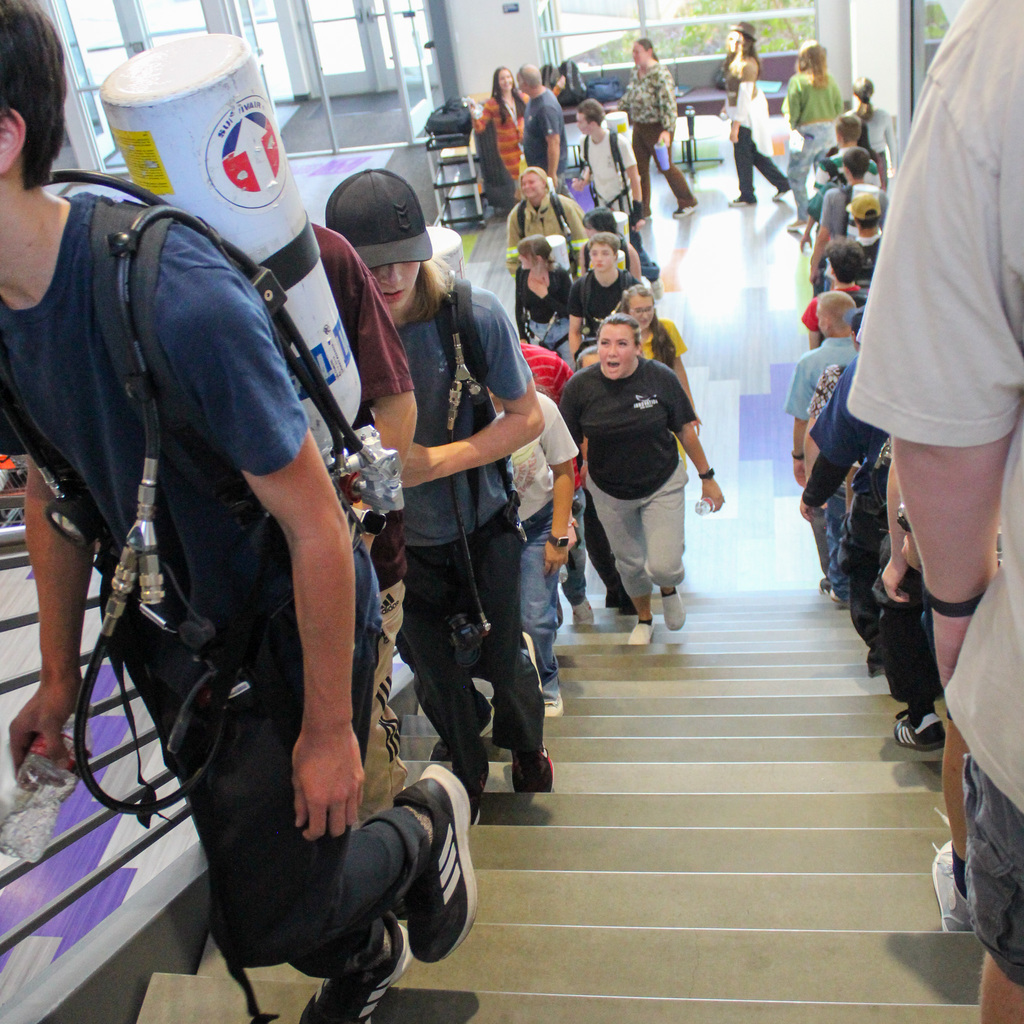students walking stairs in remembrance of 911