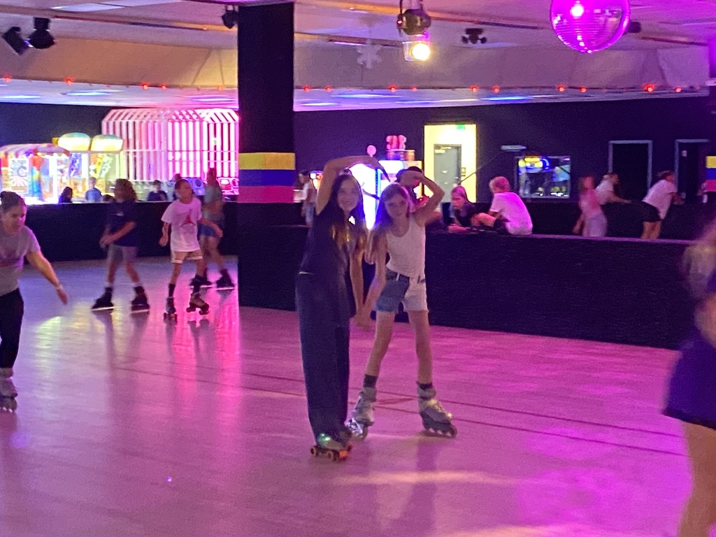 6th grade students making a heart shape while skating at Neptune Skating center for their fun field trip. 