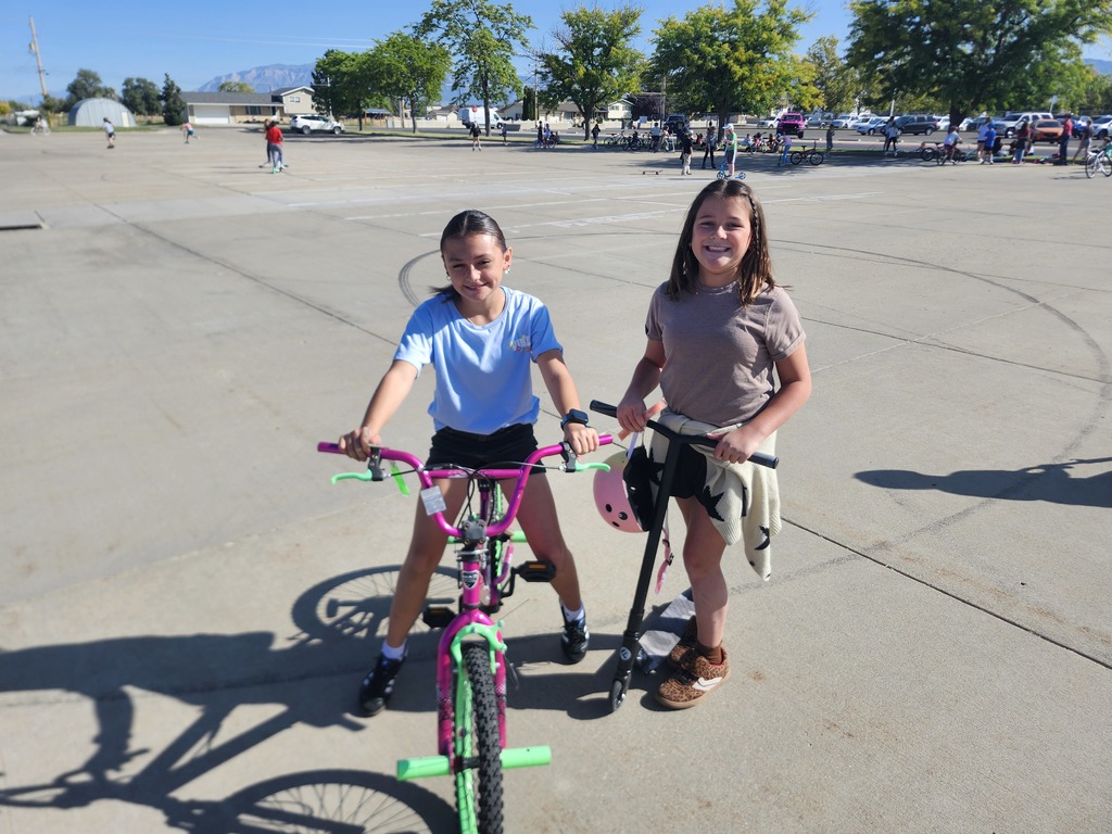 5th graders enjoying their reward, Wheels day. They brought bikes, scooters, skateboards, rollerblades and all sorts of wheels to enjoy in the church parking lot next door
