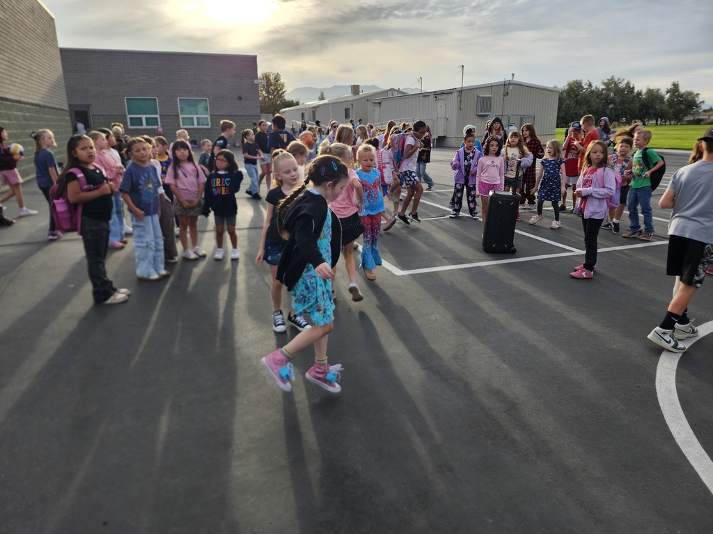 kids dancing outside in the morning for Friday Morning Music on the playground