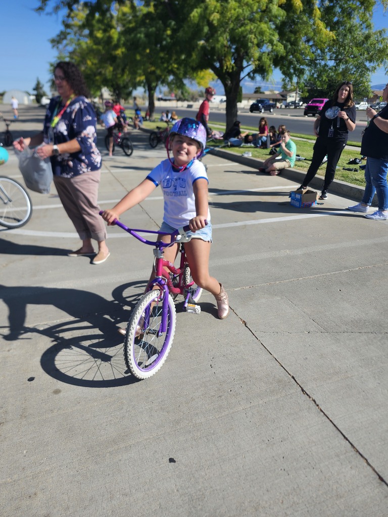 5th graders enjoying their reward, Wheels day. They brought bikes, scooters, skateboards, rollerblades and all sorts of wheels to enjoy in the church parking lot next door