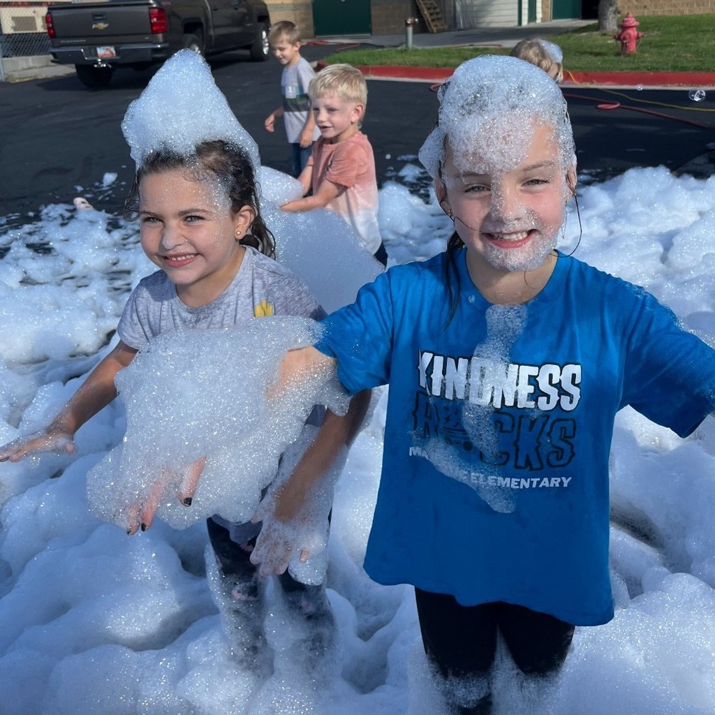 Kids playing in suds