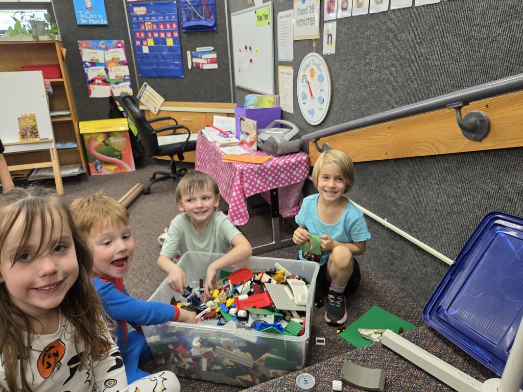 Students playing with legos. 