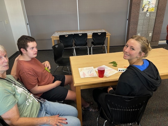 Peer tutors and the Life Skills Students in the media center 