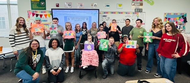 Peer tutors and the Life Skills Students in the media center 